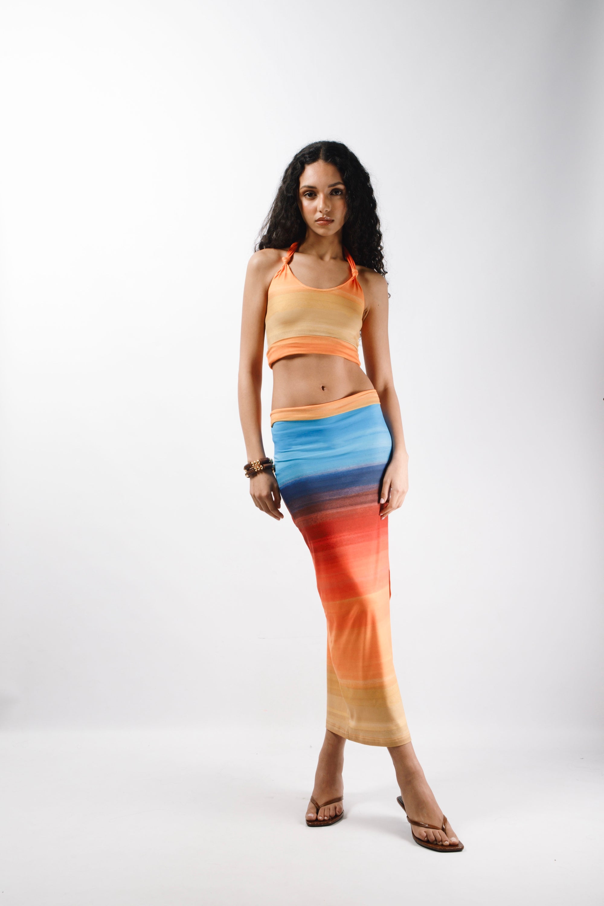 Crop top made from recycled printed Cotton featuring long self tie straps and a double returned hem - front