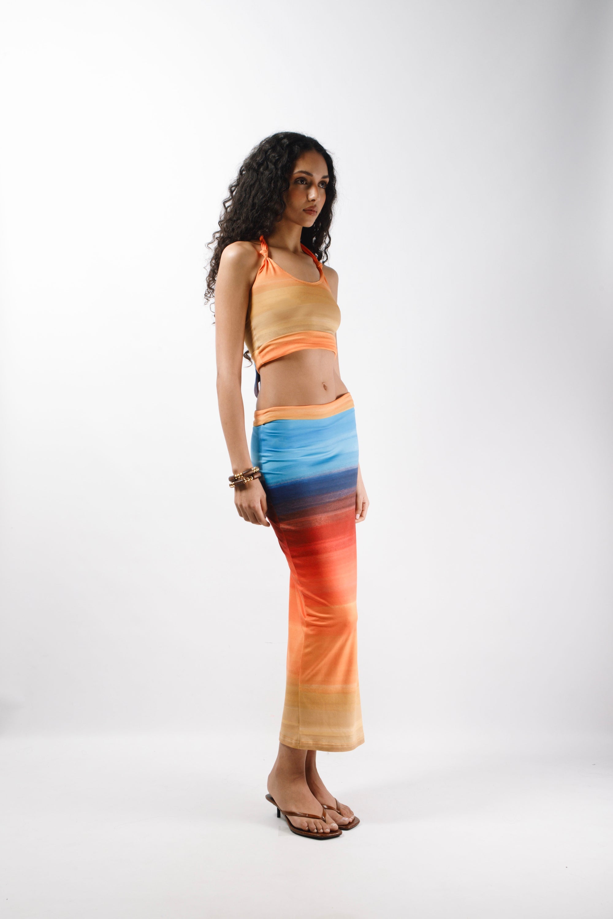 Long Skirt with a double returned waist finishing made from recycled printed cotton featuring a side slit that hits at the ankle - side