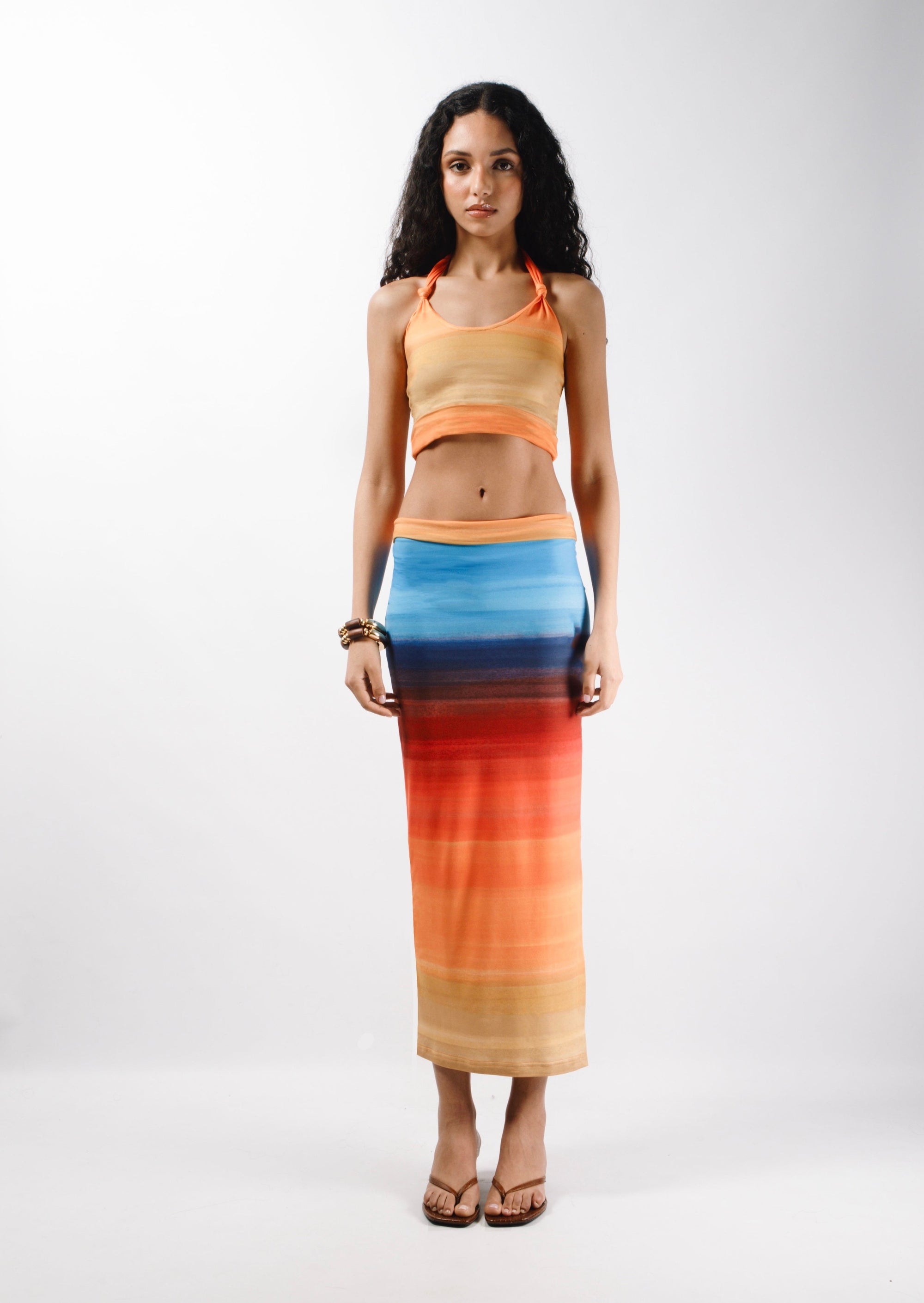Long Skirt with a double returned waist finishing made from recycled printed cotton featuring a side slit that hits at the ankle - front