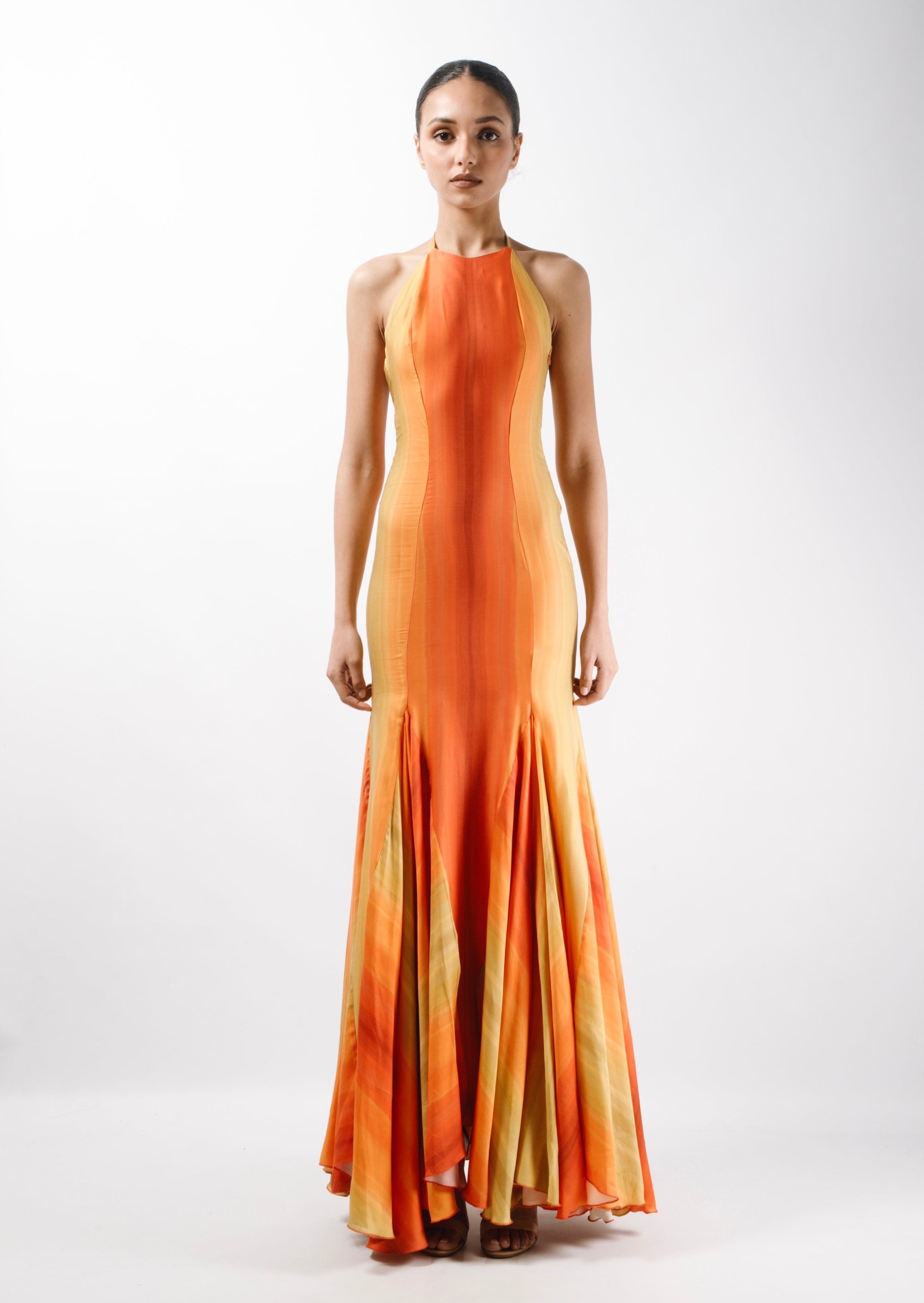 Maxi Gown Dress with long triangle godets and an American neckline with self tie straps. The Dress features an open back - front
